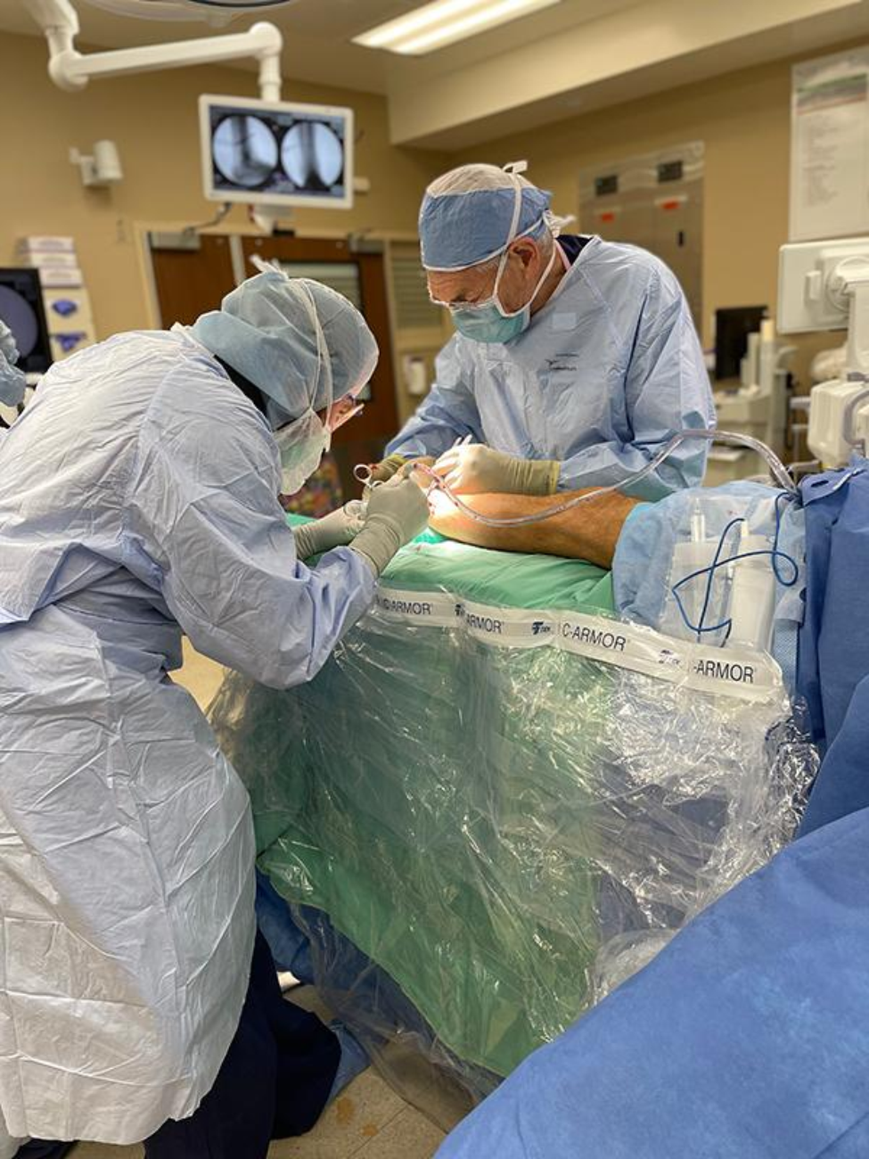 Patrick Kellam (front left) and James Kellam (back right) fix an ankle fracture. (Photo courtesy of Patrick Kellam) Patrick Kellam (front left) and James Kellam (back right) fix an ankle fracture. (Photo courtesy of Patrick Kellam)